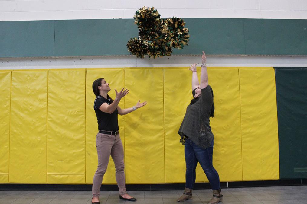 Michelle Broadhurst (l) and AJ Castle '21 celebrate a successful cheerleading season