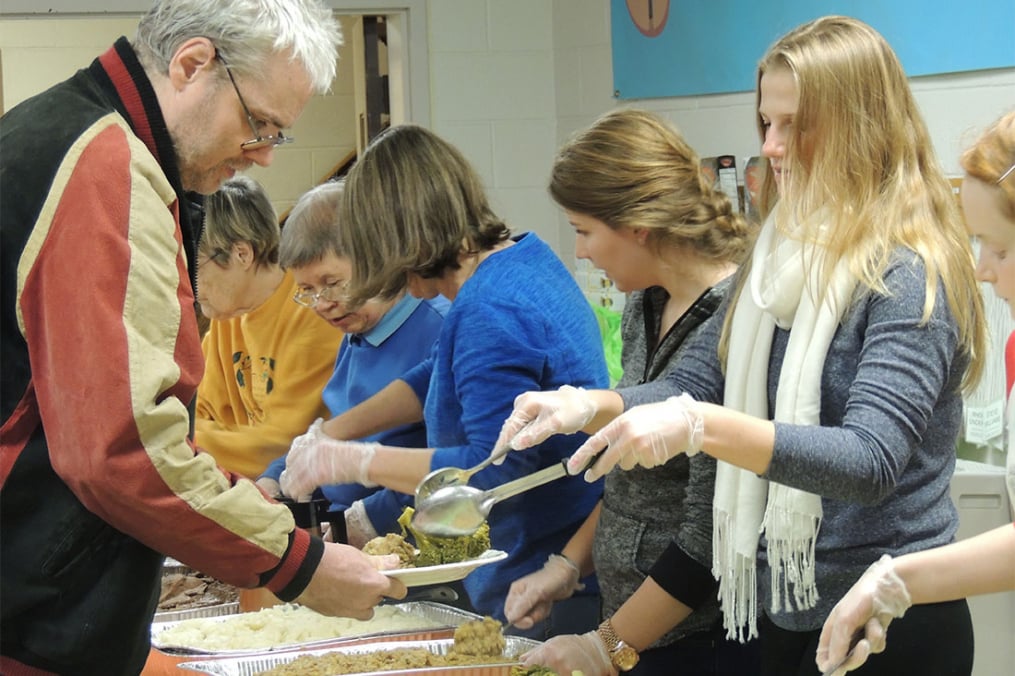 students serving food